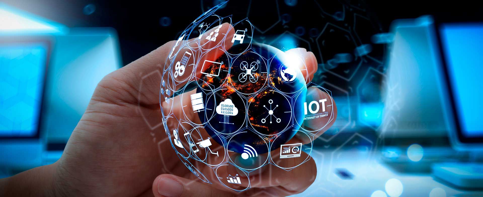 A hand holding a globe of connected-device icons